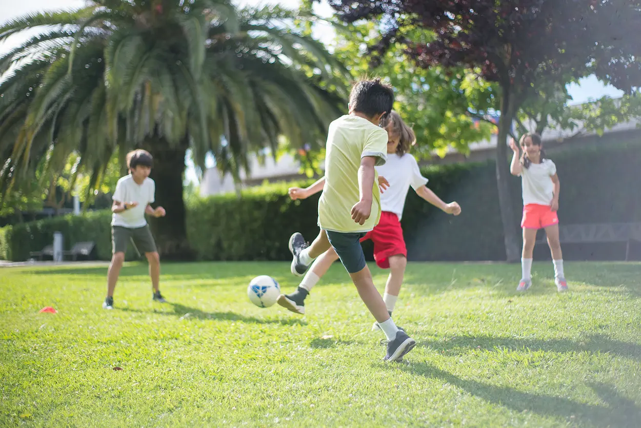 Picture of kids playing outside in the sun.